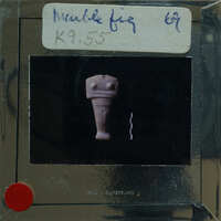 A small marble figurine on display.