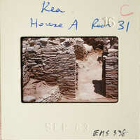 Ancient ruins with stone walls and pathways, photographed on film.