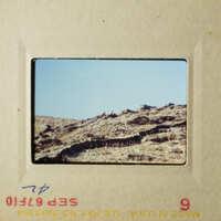 Two photos of a rocky terrain with a clear sky, possibly taken from an airplane window.