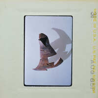 Old, weathered metal object with a pointed end and a handle, possibly an artifact or tool.