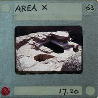 The image is a photograph of an ancient archaeological site, possibly a cave or rock shelter with stone structures and artifacts, presented on a film strip card labeled "Area X" with a price tag of £17.20.