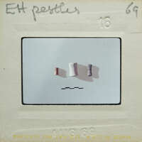 Three cylindrical items on table.