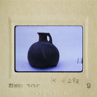 Brown clay pottery on white surface.