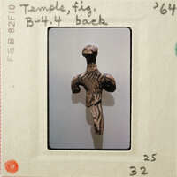 Ancient sculpture with intricate patterns and designs, displayed against a white background.