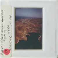 Photo of a landscape with mountains and water.