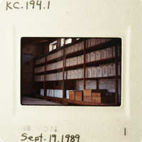 The photo shows a large room filled with filing cabinets, taken from an angle that obscures the contents of the drawers.