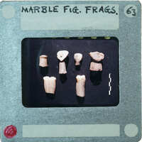 Eight pieces of stone showing variety of marble figurine fragments.