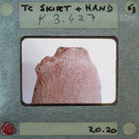 A photograph of a rock with an unusual shape, displayed on a film strip.