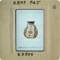 Vase with intricate patterns on a white background.