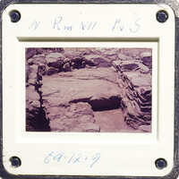 Ancient ruins with stone columns and walls, captured on an old photograph.