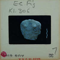 Torso of stylized marble figurine.