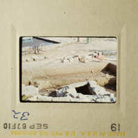 Two photographs show an archaeological site with stone ruins and rubble, likely taken from different angles.