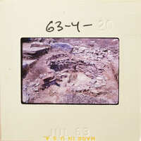 Archaeological site with ancient ruins and stone structures.