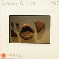 Old broken pottery pieces on display.