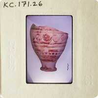 Ancient Greek vase with red-figure technique and intricate designs.