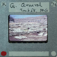 The image is a photograph of an old, possibly historical building or ruins, taken from the perspective of a film strip with a label that reads "CG GENERAL TOMB 58 MGC" and has a number "70"