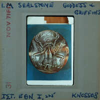 Ancient sealstone with intricate carvings of a deity or mythical creature, possibly from the Scythian culture.