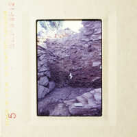 This is an image of a dirt pit with rocks and debris, taken from an elevated angle.