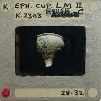 Partially complete cup (K.2303) with painted decorations.