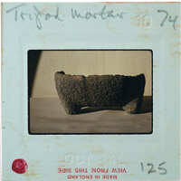 Profile of stone bowl with legs.