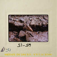 Rocky terrain with various sizes and shapes of rocks, possibly from an older photograph due to its vintage appearance.