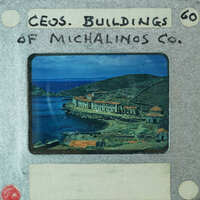 Picture of a building on water with red roof and mountains in background, framed as an old film strip.