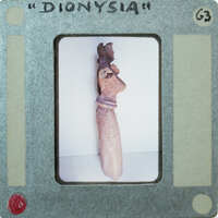 Detail of almost complete terracotta figurine from the side minus right arm.