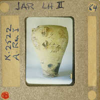 Ancient vase with intricate designs on display.