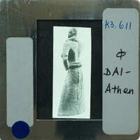 Detail of almost complete terracotta figurine from the back minus right arm.