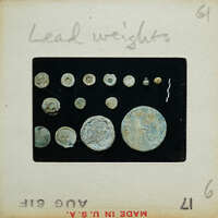 Circular lead pieces on a surface.