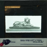 A lion statue on display, captured in an antique photograph.