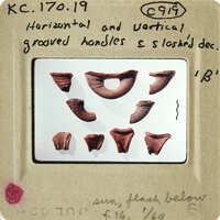 Photograph of ancient pottery shards on display.