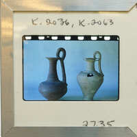Two reassembled ancient one handled jugs on display, K.2036, K.2063.
