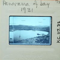 Black and white panoramic photograph of a bay with boats, taken in 1931.