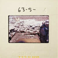 A photograph showing an excavation site with exposed rock and soil.