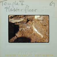 Stone walls and muddy floor.