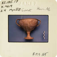 Ancient Greek vase with intricate designs.