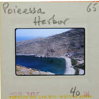 A slide of a scenic harbor and mountains.