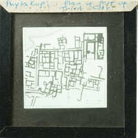 Black and white map of an urban area with various structures, possibly from an old city plan.