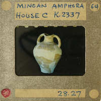 Ancient Greek vase with detailed artwork on display.