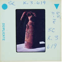 Headless restored terracotta figuring from front.