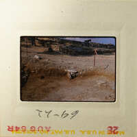 Ancient ruins with dirt and rocks, possibly from an archaeological site.