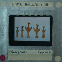 Picture of a projector screen displaying images of ancient figurines with labels.