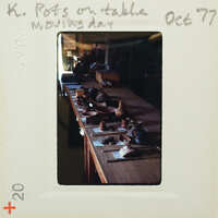 A table with a variety of pottery and clay items on it.