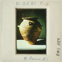 A photograph of an ancient vase with intricate designs.