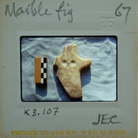 Marble figurine fragment.