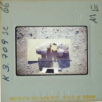 A film strip with a photograph of two rocks on it.