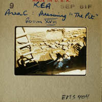 Archaeological dig site with a person working on excavation.