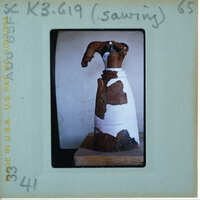 Headless restored terracotta figuring from front.