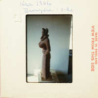 Brown clay sculpture on display.